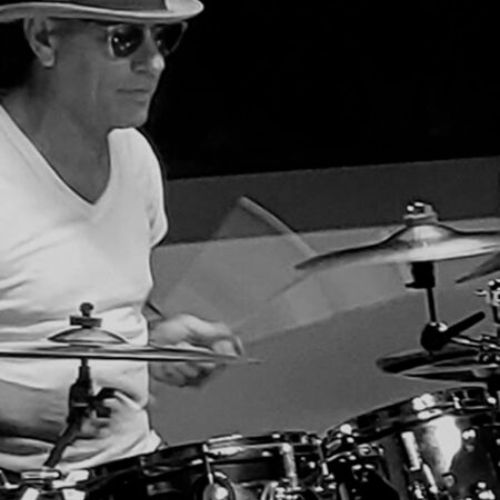 professional-drummer-Darren-Elliott-in-studio-playing-his-drumset